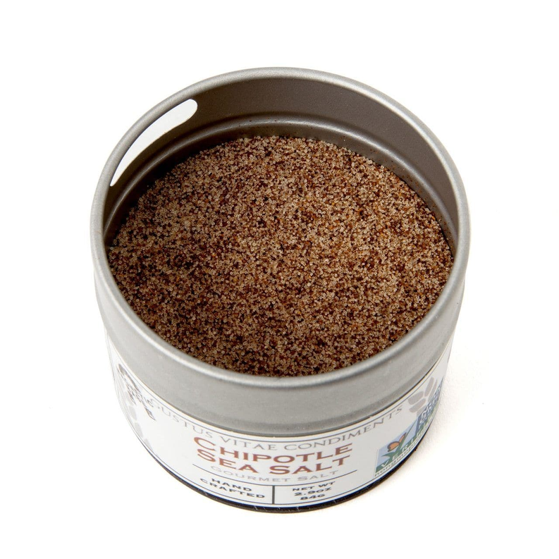 Sea salt tin filled with fine dark brown granules