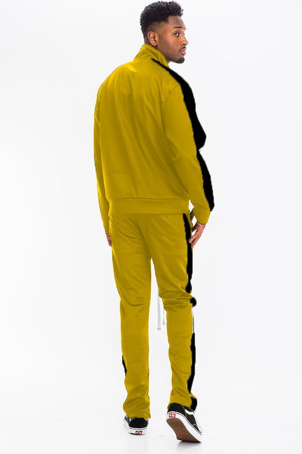 Men's yellow track set with stand-collar zip jacket and black side stripes, profile view