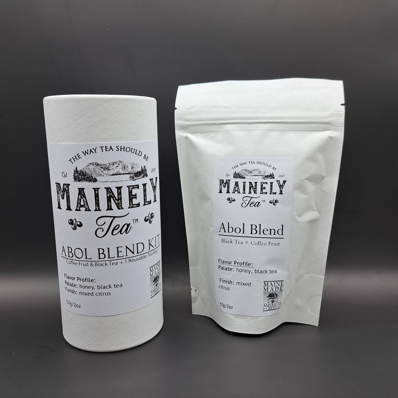 Loose leaf tea blend canister and stand-up pouch, white packaging with MaineLy Tea label