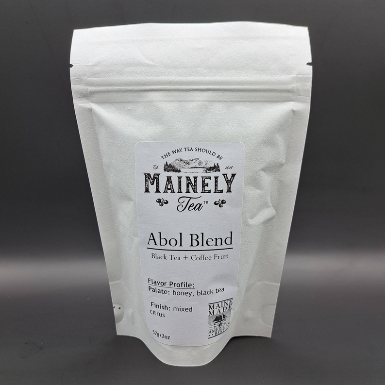 Stand-up pouch of loose leaf tea blend, white pack with MaineLy Tea Abol Blend label