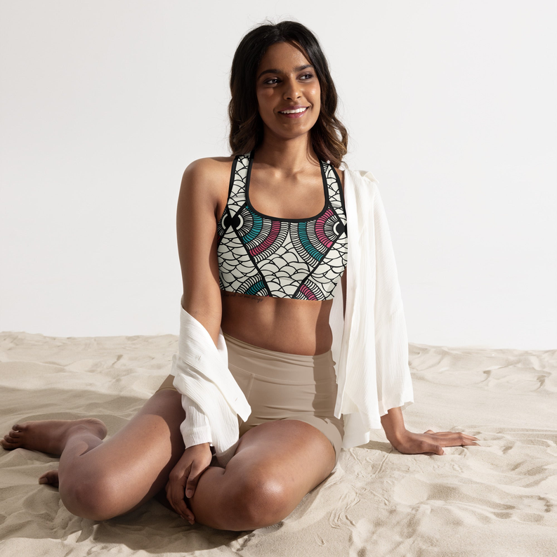 Padded sports bra with colorful geometric pattern and black trim, racerback design