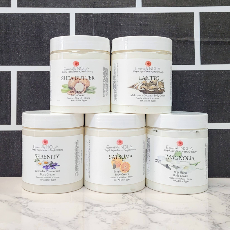 Assorted body cream jars with white lids
