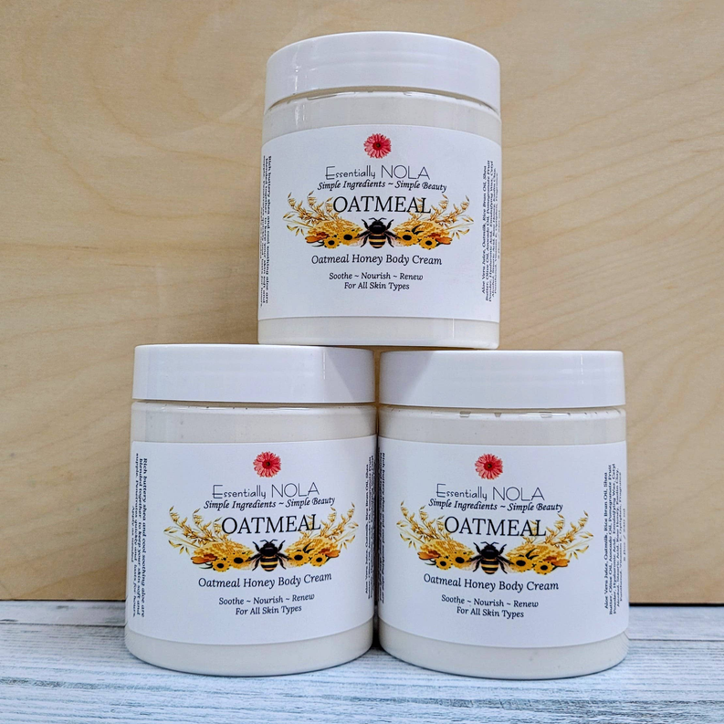 Stack of body cream jars with white lids