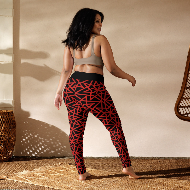 Women's yoga leggings with red geometric pattern on black, side view