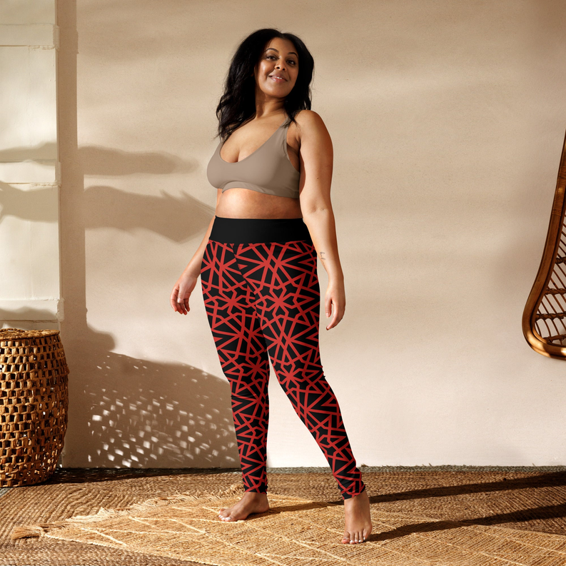 Women's yoga leggings in black with red geometric print, standing front view