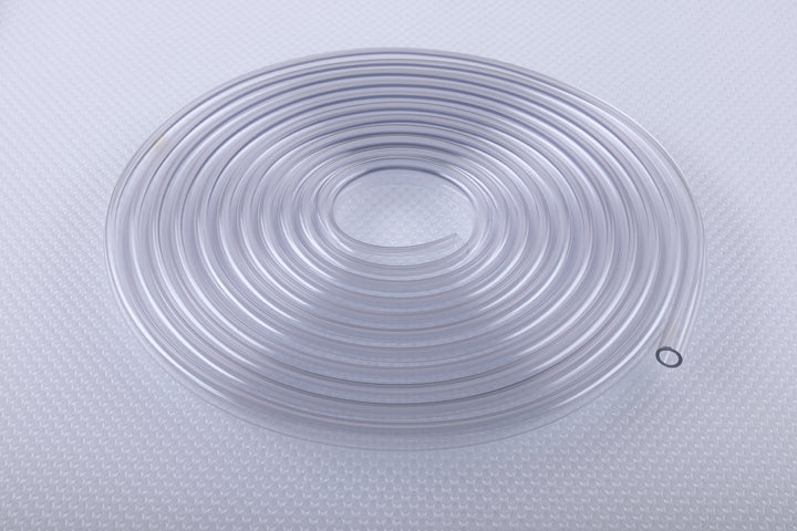 Clear flexible cord, neatly coiled into a flat ring