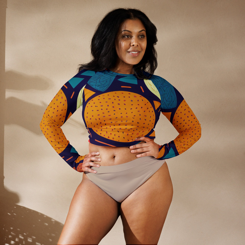 Multicolored women's long sleeve crop top, front view, bold teal and orange abstract print