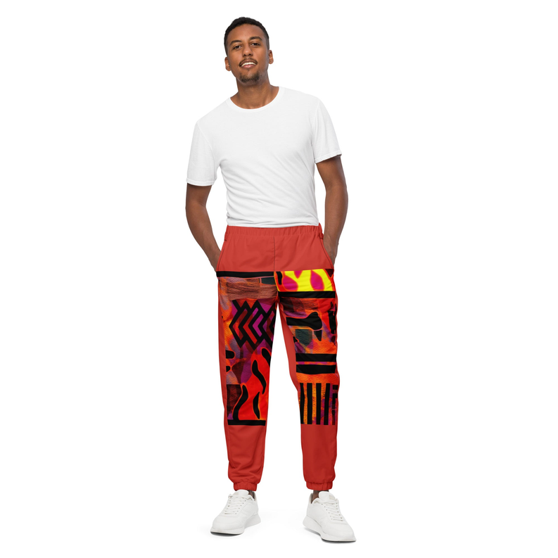 Red track pants with colorful abstract graphic print on the legs