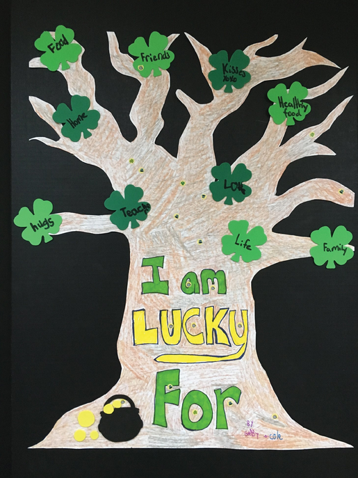 Green foam shamrock tree wall cut-out with “I Am Lucky For” text accents