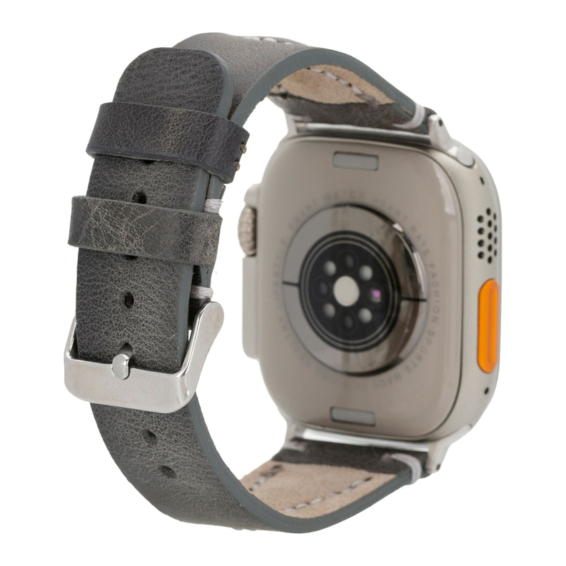 Close-up gray leather Apple Watch band with metal clasp and stitched lining
