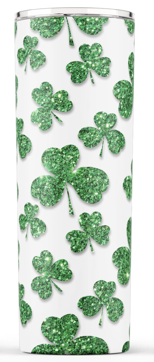 Stainless steel tumbler with white base and scattered green clover pattern