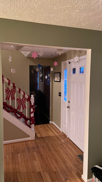 Foam snowflake cut-outs decorating doorway and nearby walls