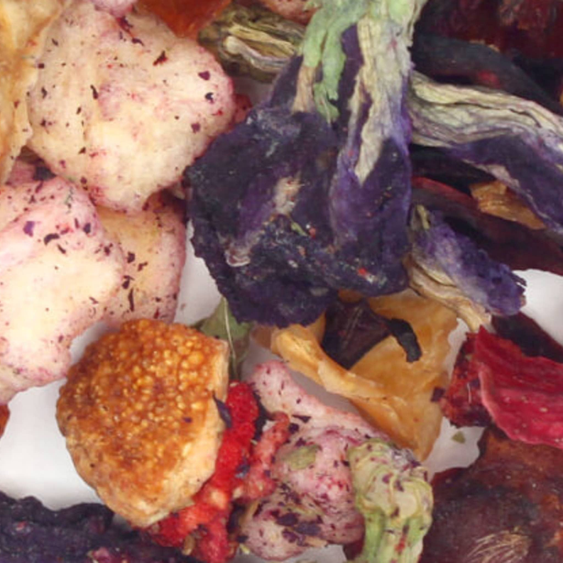 Violet papaya and berry tea blend ingredients in dried fruit and herbs