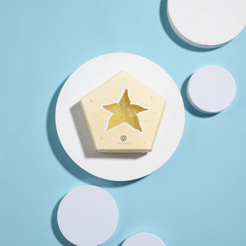 Star-shaped soap bar in a yellow gift box with gold star graphic.