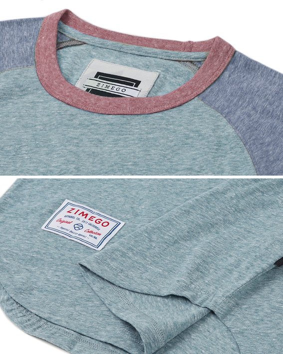 Close-up of men's raglan ringer T-shirt neckline and tag; teal fabric with rust trim