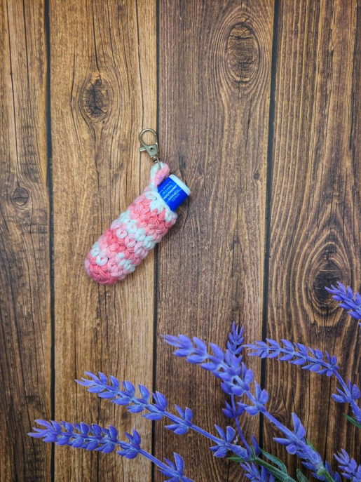 Pink crocheted keychain chapstick holder with attached chapstick tube
