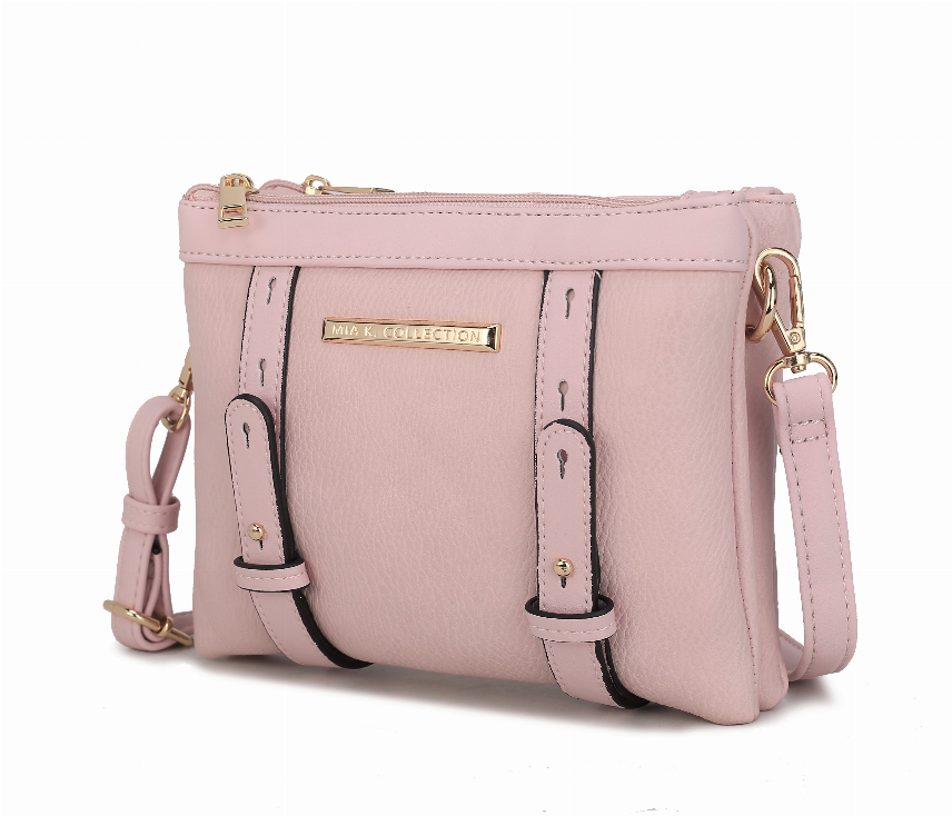 Pink multi-compartment crossbody bag with front pockets, gold hardware, adjustable strap