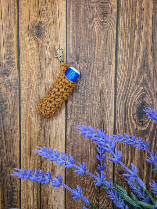 Braided keychain chapstick holder with metal clip and blue lip balm tube