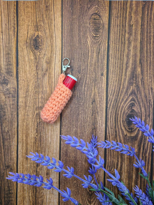 Crochet keychain chapstick holder with keyring, pink fabric and red lip balm