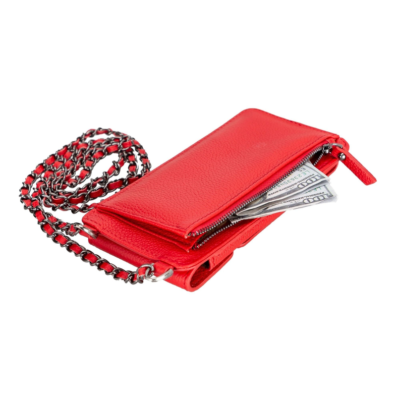 Red leather crossbody wallet with zipper and chain, holding cards and cash