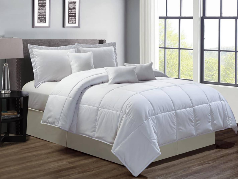 Light blue comforter set with stitched baffle quilting and layered bed pillows