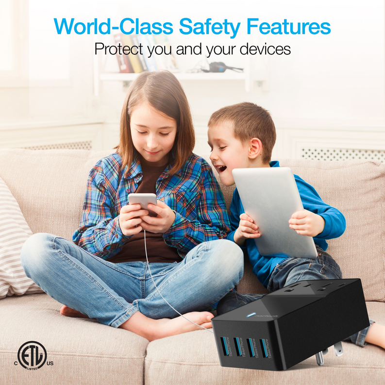 Black multi-device USB charger with blue indicator, shown plugged in beside sofa