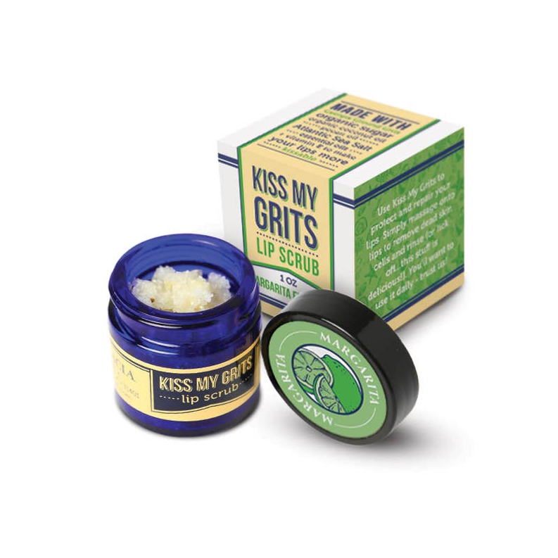 Kiss My Grits lip scrub jar with blue container, black lid, and box packaging