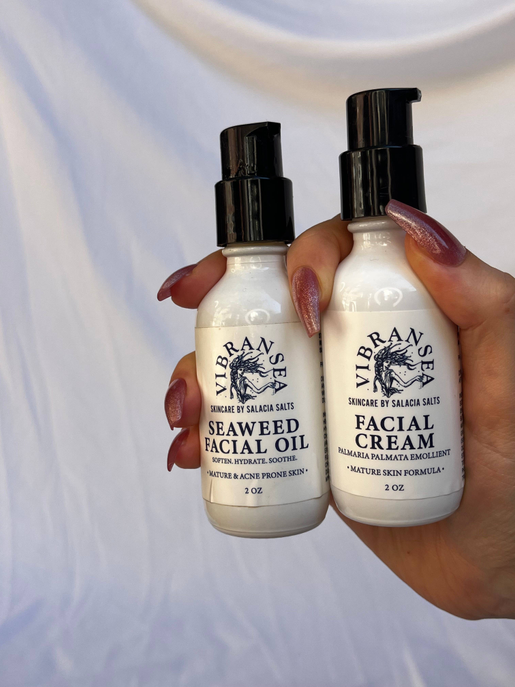 Vibransea hyaluronic acid facial cream bottle with black pump, held side-by-side