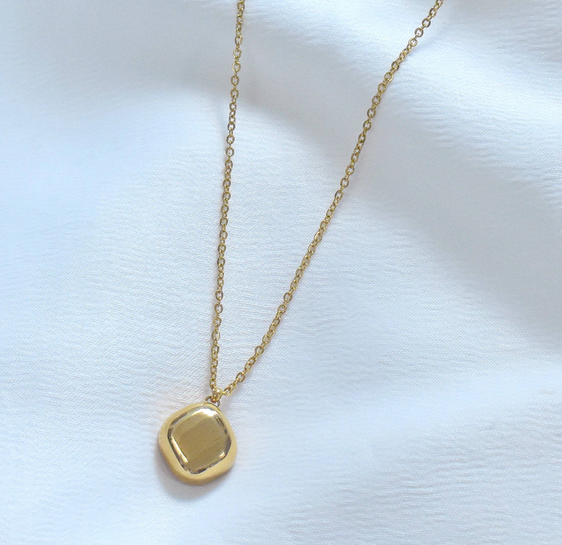Gold square-insert pendant on fine chain, no visible gemstone