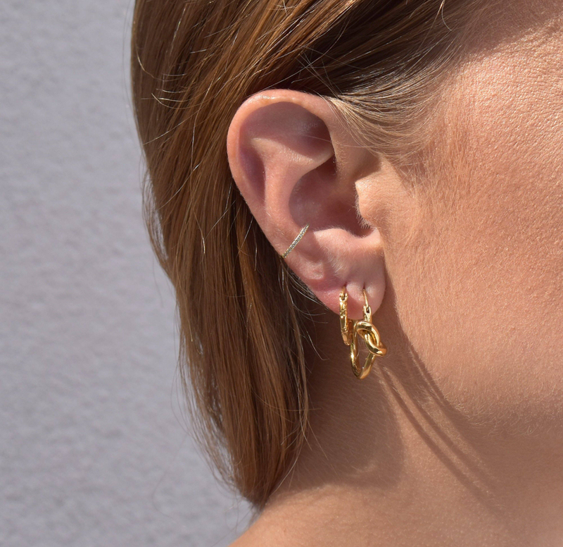 Gold star drop earring with stacked ear cuffs and small hoop
