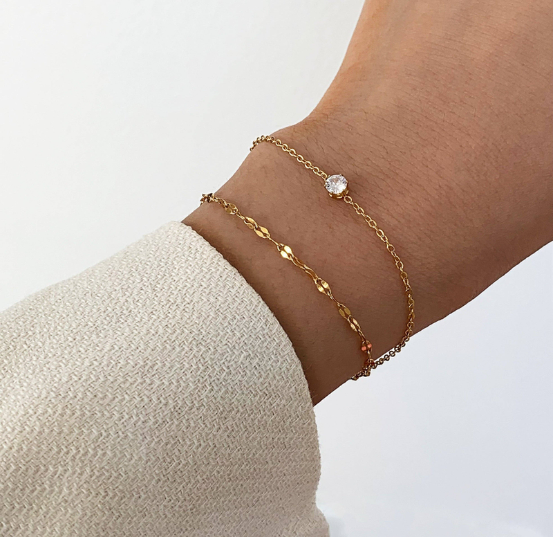 Gold dainty bracelet duo with small round clear stones on fine chain