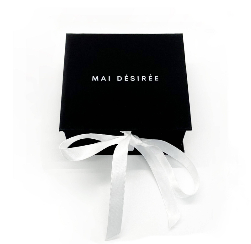 Black MAI DÉSIRÉE gift box with white ribbon