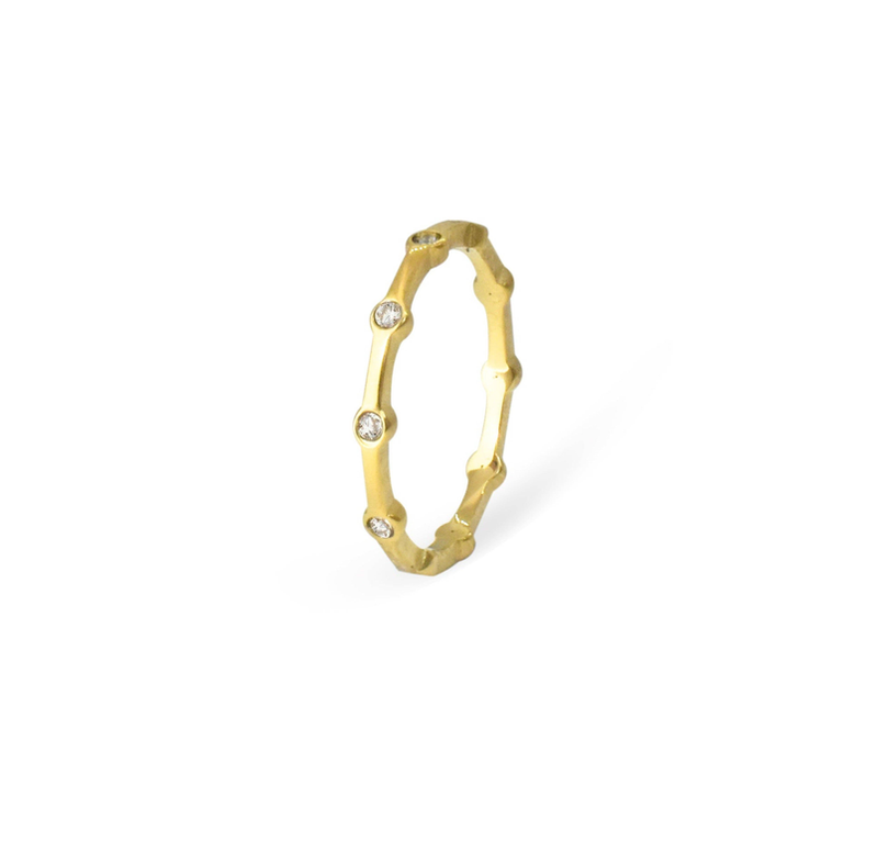 Gold-tone thin pave ring side view with open center and small round stones