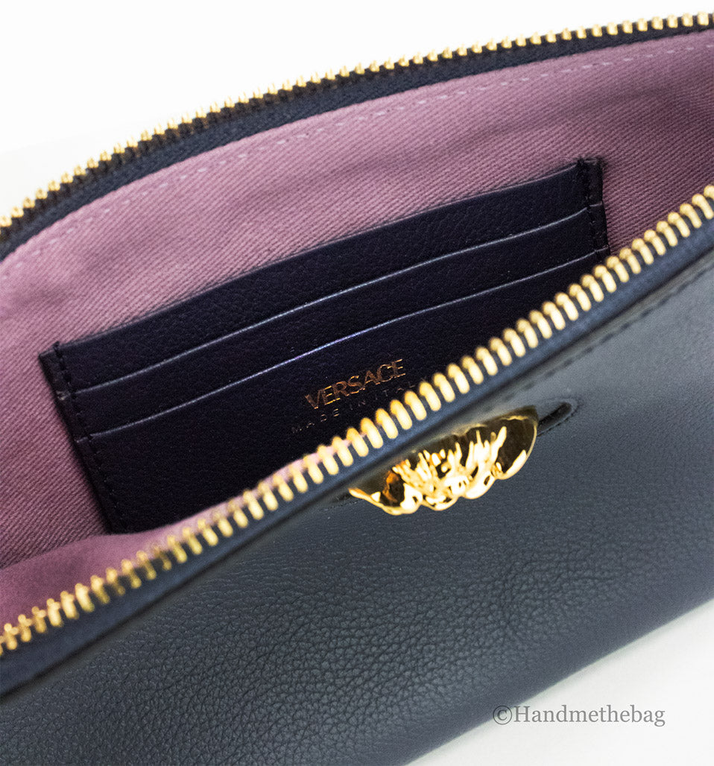 Navy leather wristlet pouch interior with Versace card slots and gold zipper