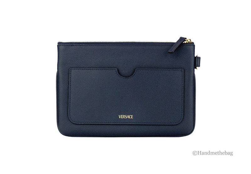 Navy pebbled leather wristlet pouch with front flap pocket and gold zip pull