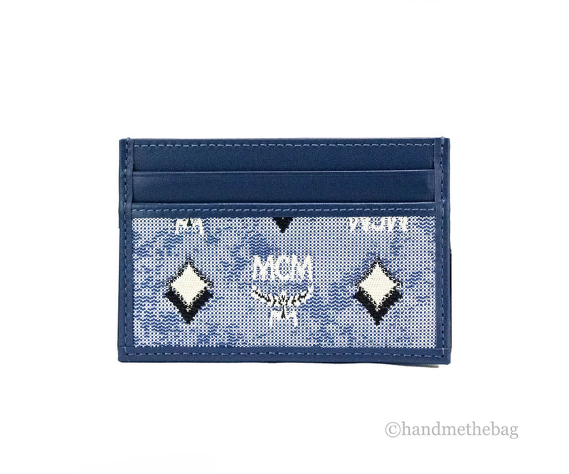 Blue denim card case front with MCM monogram, diamond motifs, and stitched edges