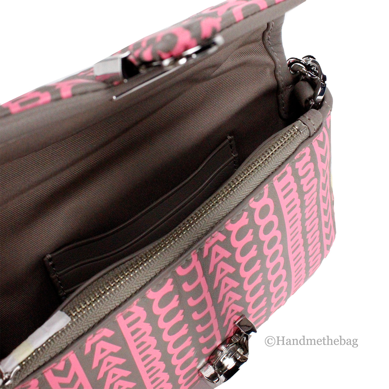 Pink monogram mini shoulder bag close-up with silver chain and zipper pocket detail.