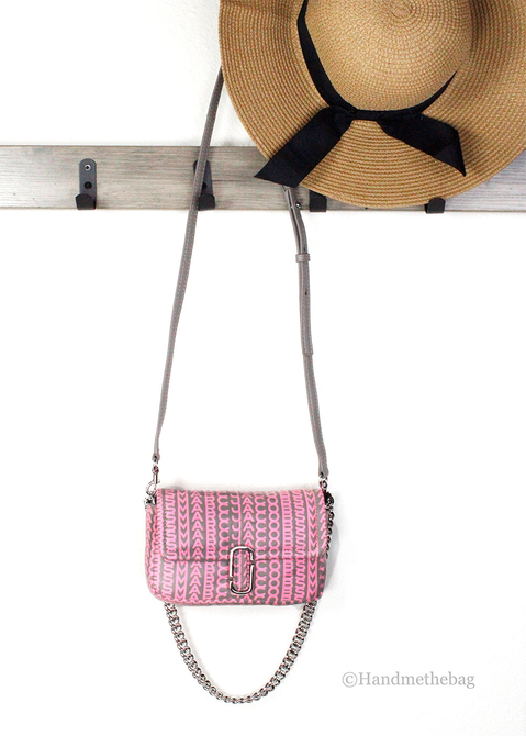 Pink monogram mini shoulder bag with silver chain strap and flap closure.