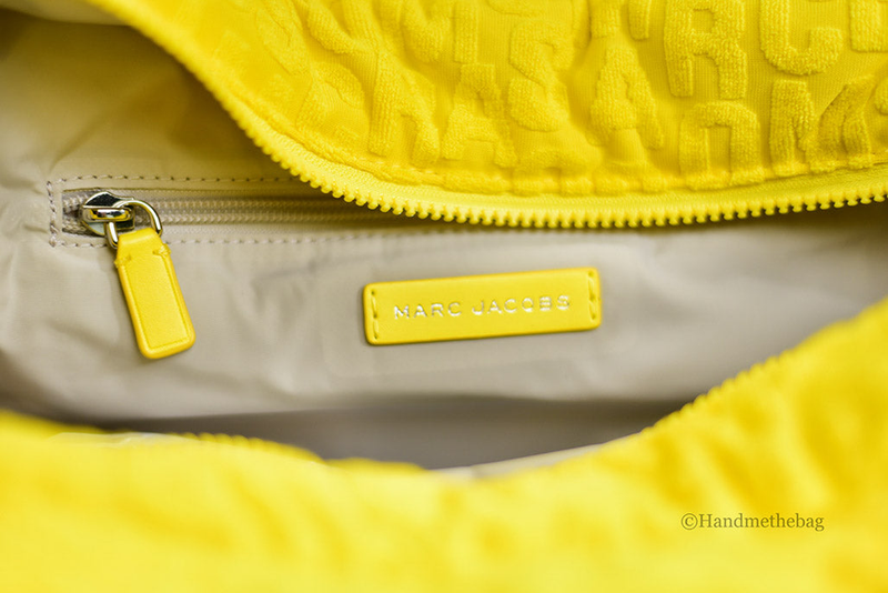 Bright yellow terry monogram tote with zippered opening and small logo patch on lining