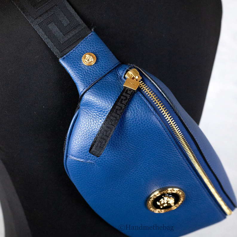 Blue leather fanny pack with gold Medusa hardware and black zip pull