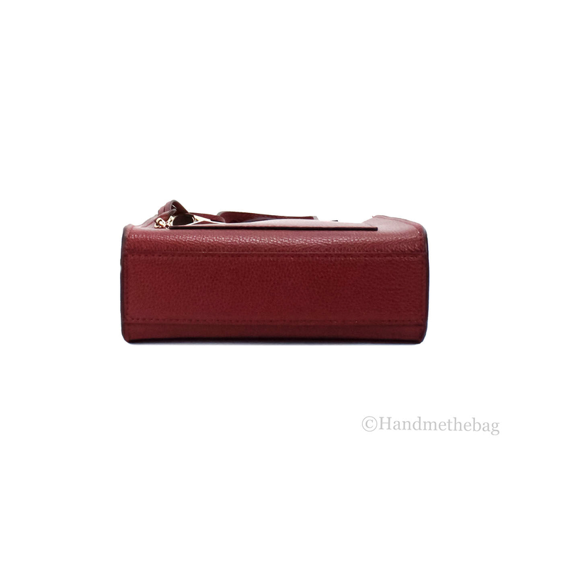 Pomegranate red micro mini leather bag with zip-top closure, top view