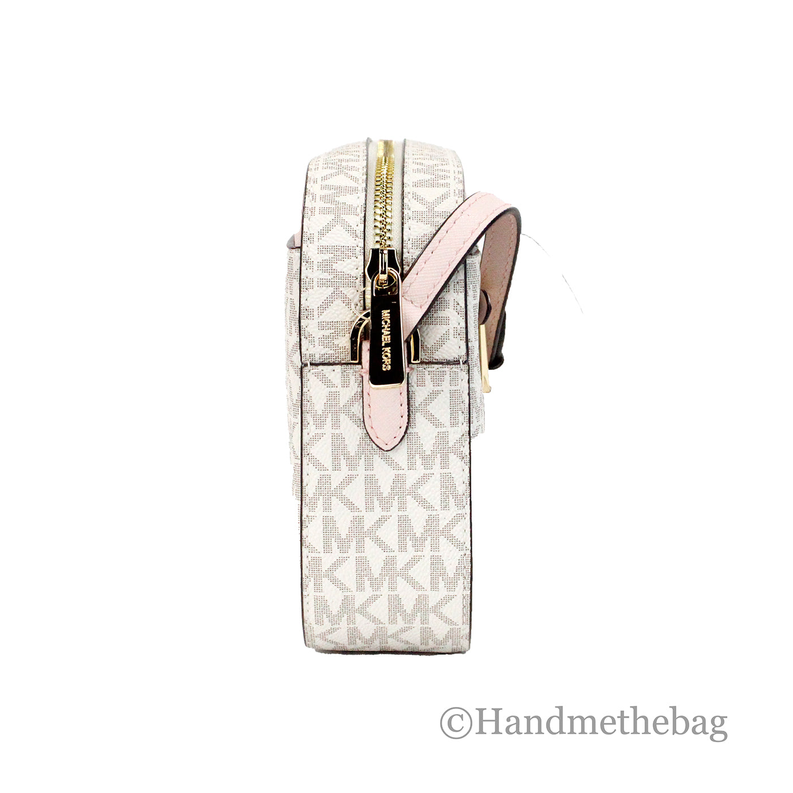 Michael Kors crossbody bag side view with pink-trim flap and gold-tone zipper pull