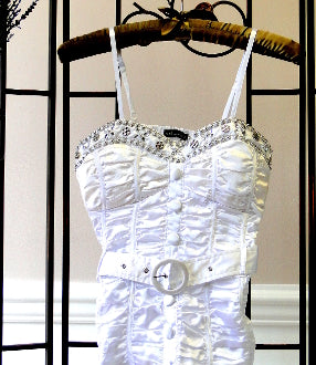 White ruched camisole-style top with silver beaded neckline and center charm
