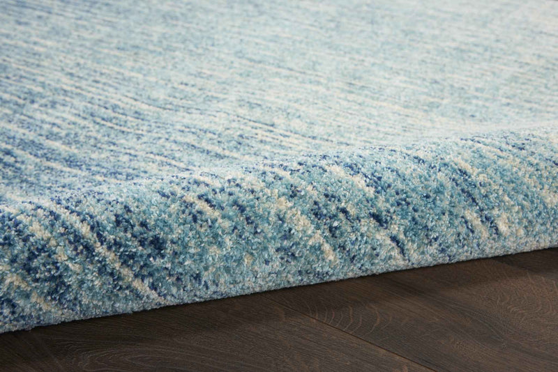 8' Ivory And Blue Round Abstract Power Loom Area Rug