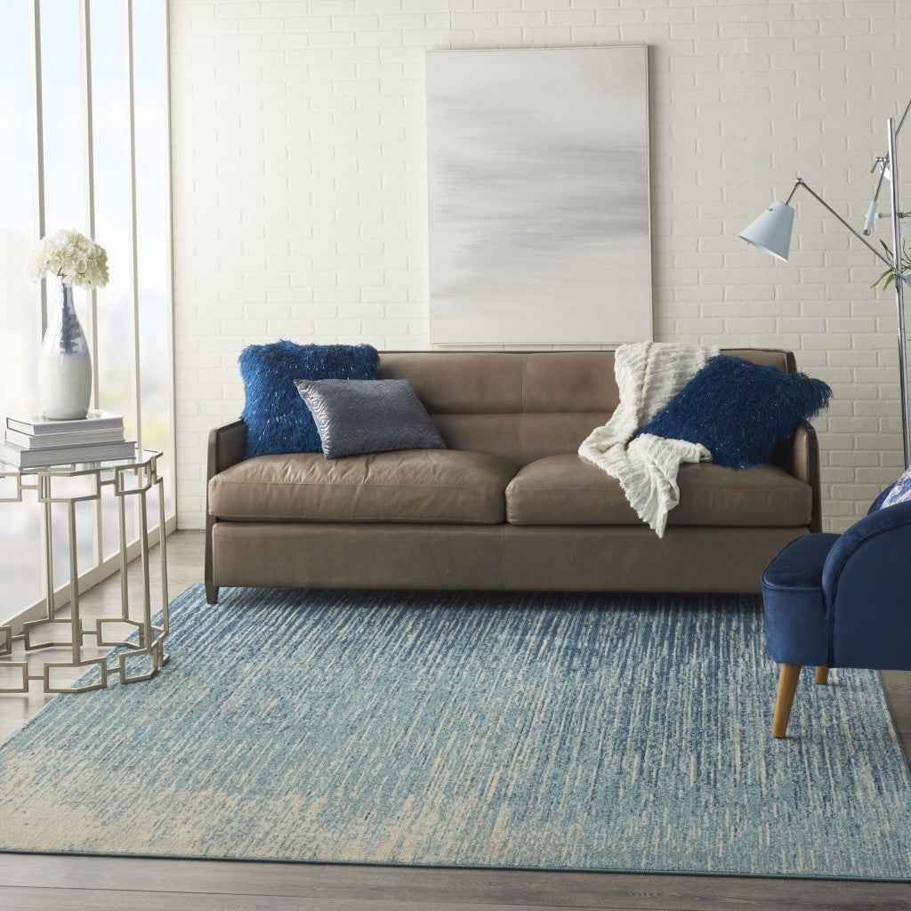 7' X 10' Ivory And Blue Abstract Power Loom Area Rug