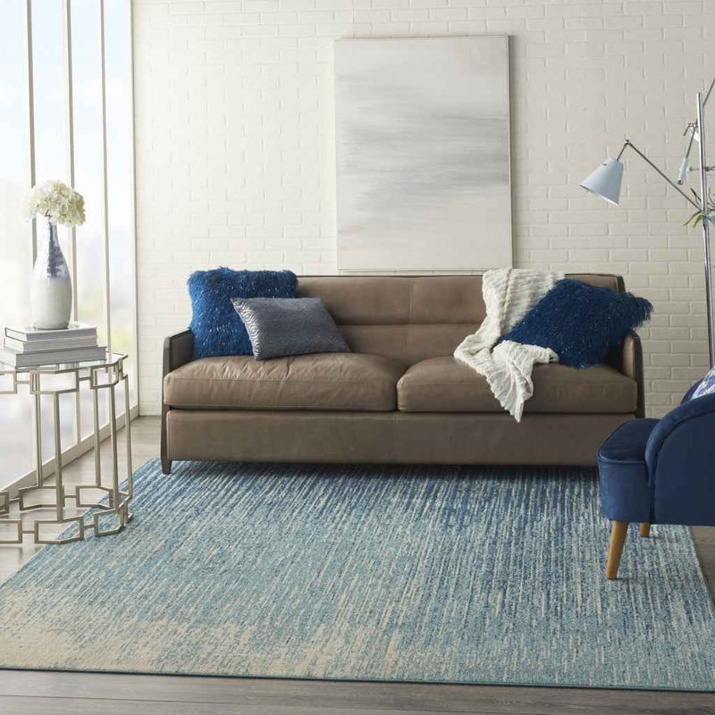 7' X 10' Ivory And Blue Abstract Power Loom Area Rug