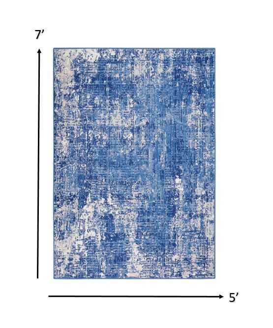 5' X 7' Blue And Ivory Abstract Dhurrie Area Rug