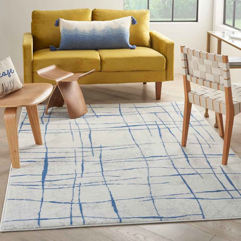 5' X 7' Blue And Ivory Abstract Dhurrie Area Rug