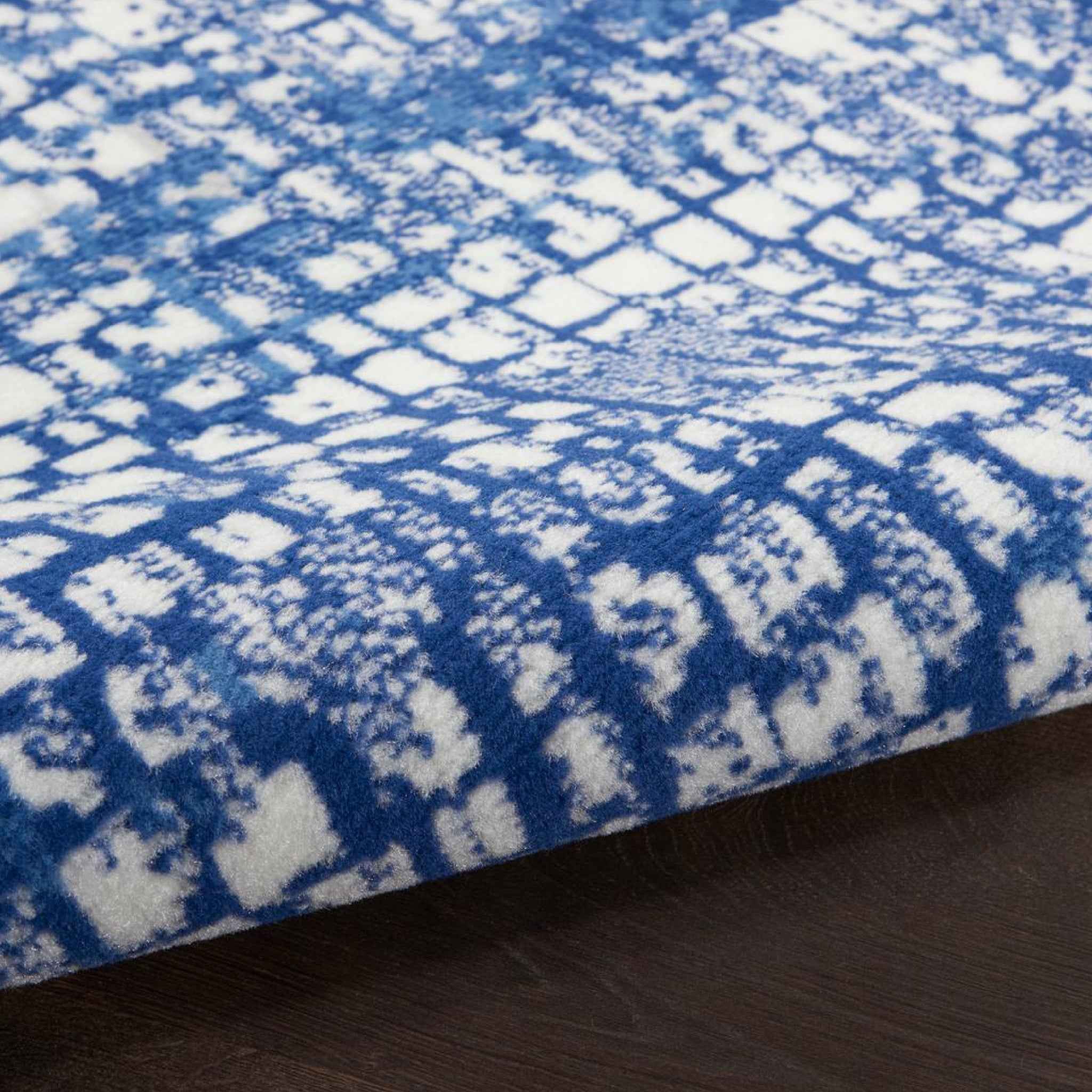 5' X 7' Blue And Ivory Abstract Dhurrie Area Rug