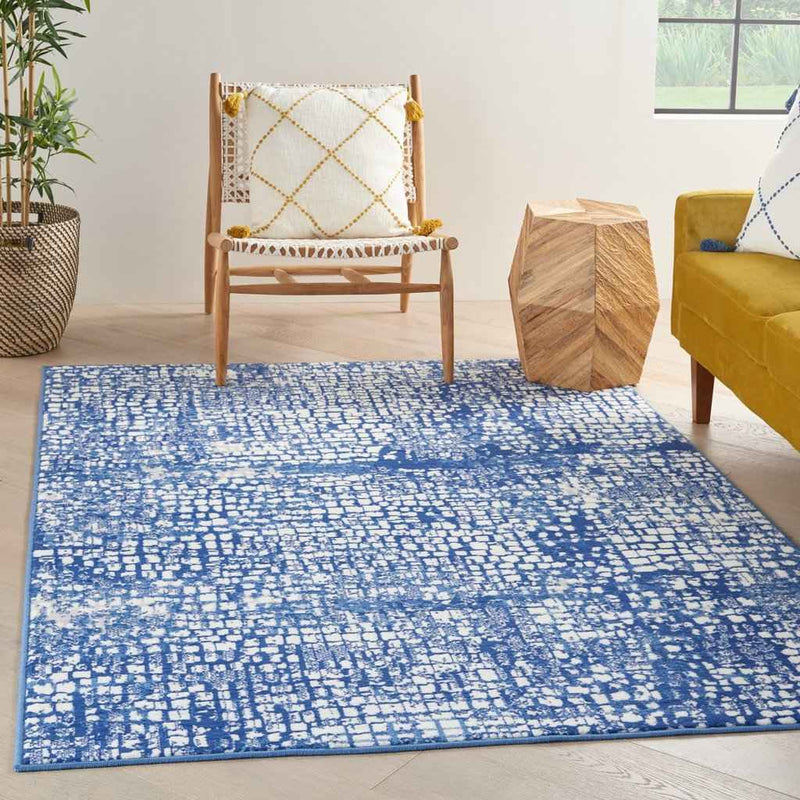 5' X 7' Blue And Ivory Abstract Dhurrie Area Rug